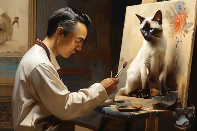 This is a photo of a painter painting a Siamese cat...